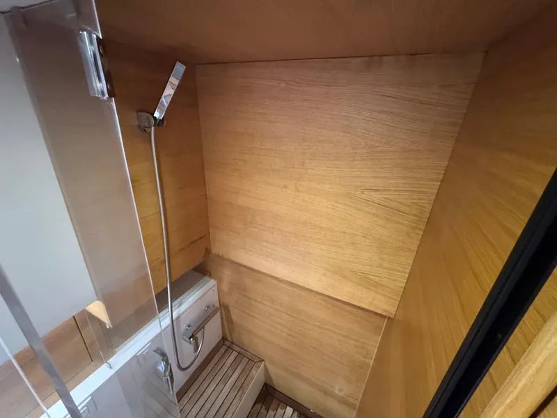 Slide: The Image of Luxurious wooden interior of 2021 De Antonio Yachts D42 bathroom with modern fixtures. - 28