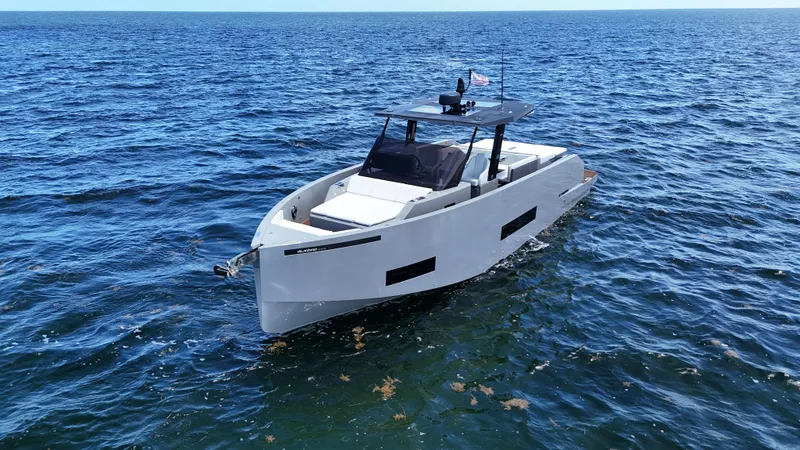 Slide: The Image of 2021 De Antonio Yachts D42 cruising on open water, showcasing sleek design and luxury features. - 3