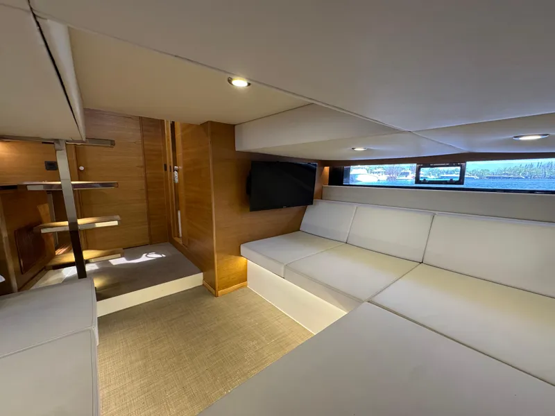 Slide: The Image of Luxurious interior of 2021 De Antonio Yachts D42 with modern seating and wooden accents. - 31