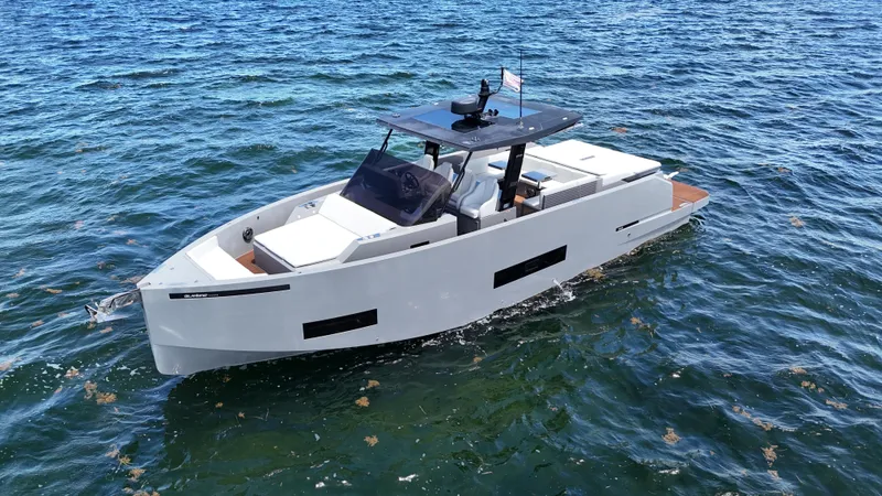 Slide: The Image of 2021 De Antonio Yachts D42 cruising on open water, showcasing sleek design and modern features. - 6