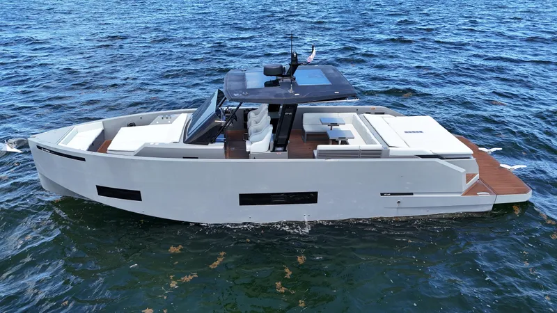 Slide: The Image of 2021 De Antonio Yachts D42 cruising on open water, showcasing sleek design and modern features. - 8