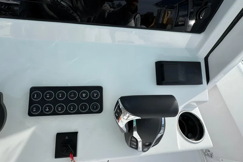 Slide: The Image of 2026 Sportsman Heritage 231 Center Console dashboard with controls and cup holder. - 11