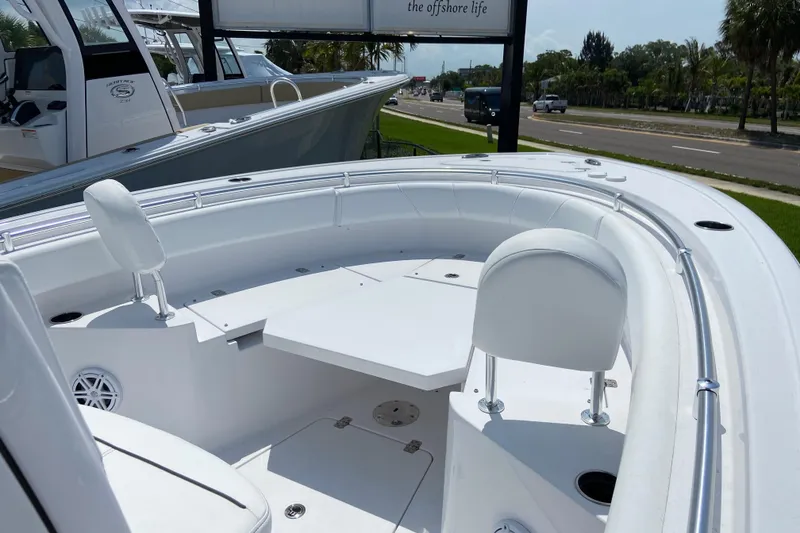 Slide: The Image of 2026 Sportsman Heritage 231 Center Console boat interior with seating and table. - 20