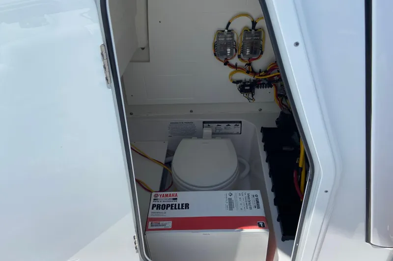 Slide: The Image of Storage compartment of 2026 Sportsman Heritage 231 Center Console with Yamaha propeller box. - 25