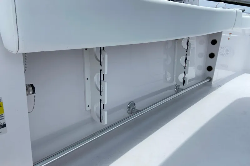 Slide: The Image of Interior view of 2026 Sportsman Heritage 231 Center Console boat, showcasing storage features. - 27