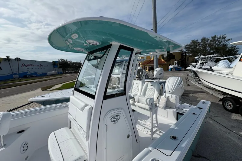Slide: The Image of 2026 Sportsman Heritage 231 Center Console boat at marina, showcasing sleek design and modern features. - 3