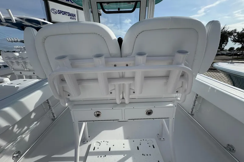 Slide: The Image of 2026 Sportsman Heritage 231 Center Console boat interior with rod holders and seating. - 7