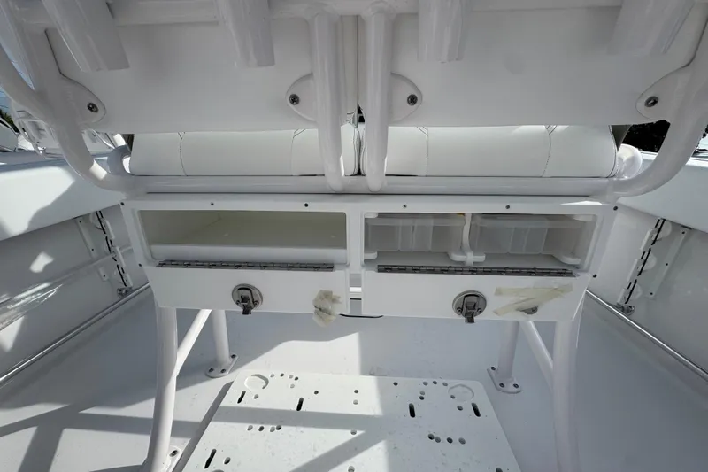 Slide: The Image of 2026 Sportsman Heritage 231 Center Console interior storage compartments, showcasing sleek design and functionality. - 8