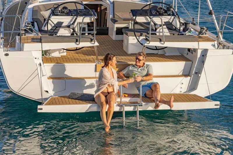 Slide: The Image of Couple relaxing on 2023 Hanse 460 yacht, enjoying the sun and sea. - 13