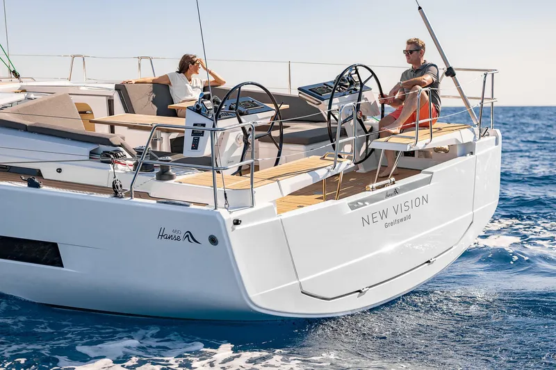 Slide: The Image of 2023 Hanse 460 yacht sailing with two people relaxing on deck. - 14