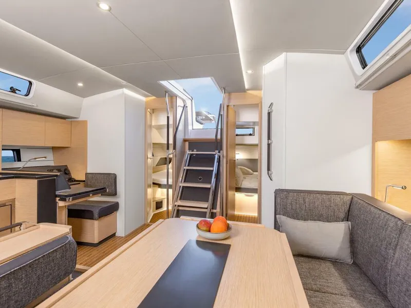 Slide: The Image of Modern interior of 2023 Hanse 460 yacht with stylish seating and dining area. - 31