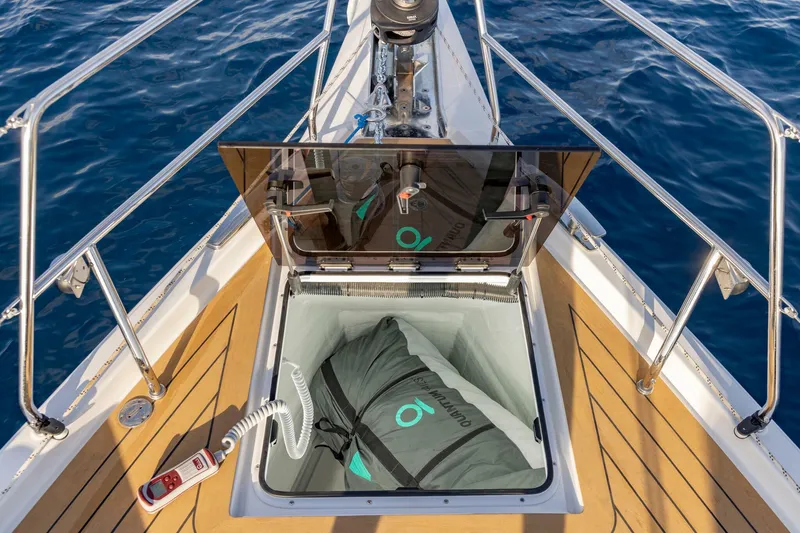 Slide: The Image of 2023 Hanse 460 yacht bow with open storage compartment and ocean view. - 9