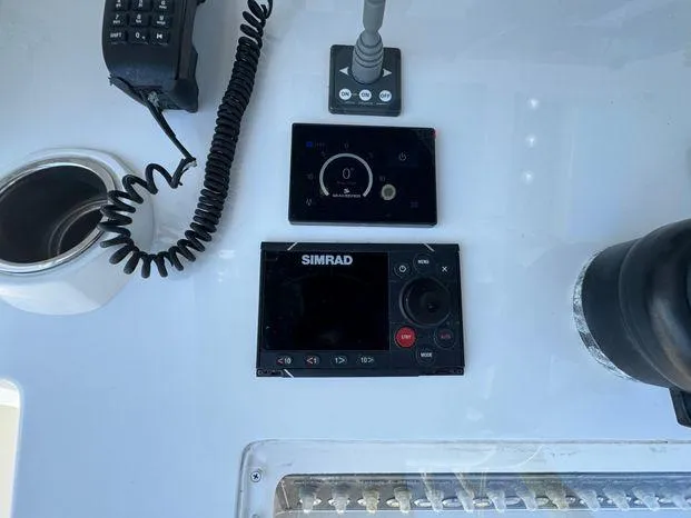 Slide: The Image of Control panel of 2015 Invincible 39 Open Fisherman with Simrad navigation system. - 12