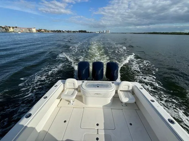 Slide: The Image of 2015 Invincible 39 Open Fisherman boat cruising on open water. - 23