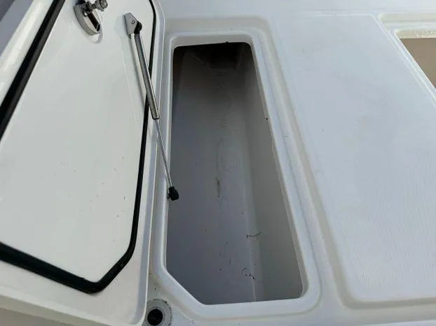 Slide: The Image of 2015 Invincible 39 Open Fisherman storage compartment with open hatch. - 29