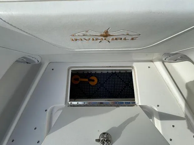 Slide: The Image of 2015 Invincible 39 Open Fisherman boat interior with storage compartment. - 32