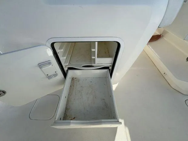 Slide: The Image of Open storage compartment on 2015 Invincible 39 Open Fisherman boat. - 34