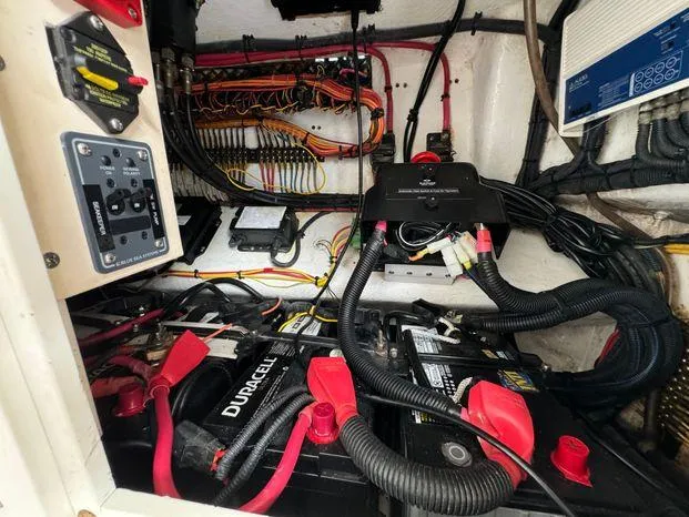 Slide: The Image of Electrical system of a 2015 Invincible 39 Open Fisherman boat, featuring batteries and wiring. - 41