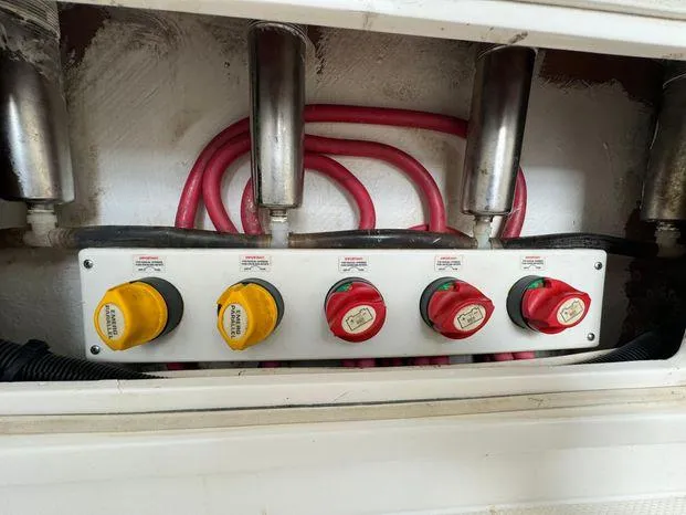 Slide: The Image of Control panel with switches and cables on a 2015 Invincible 39 Open Fisherman boat. - 44