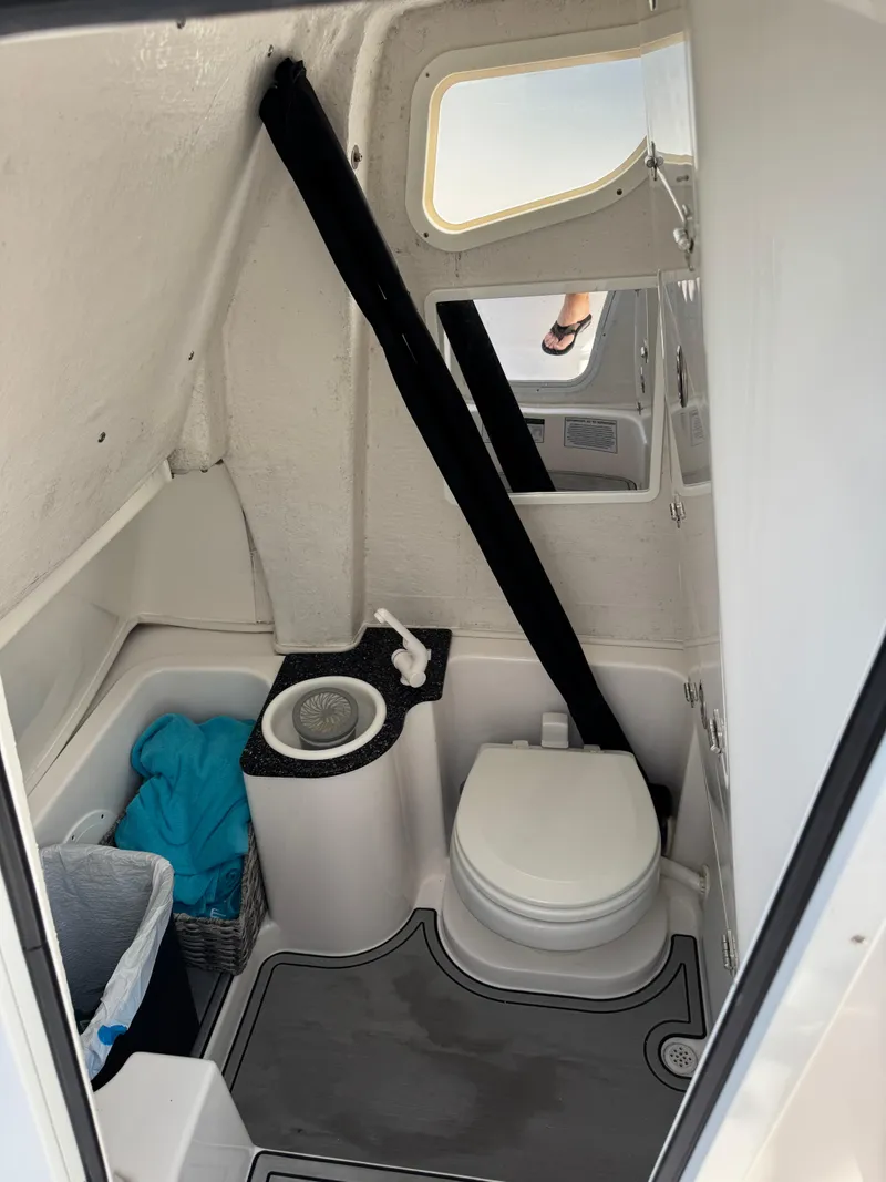 Slide: The Image of 2023 Sea Fox 268 Commander boat interior with toilet and sink. - 13