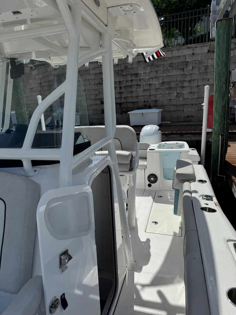 Slide: The Image of 2023 Sea Fox 268 Commander boat interior with seating and control panel. - 14