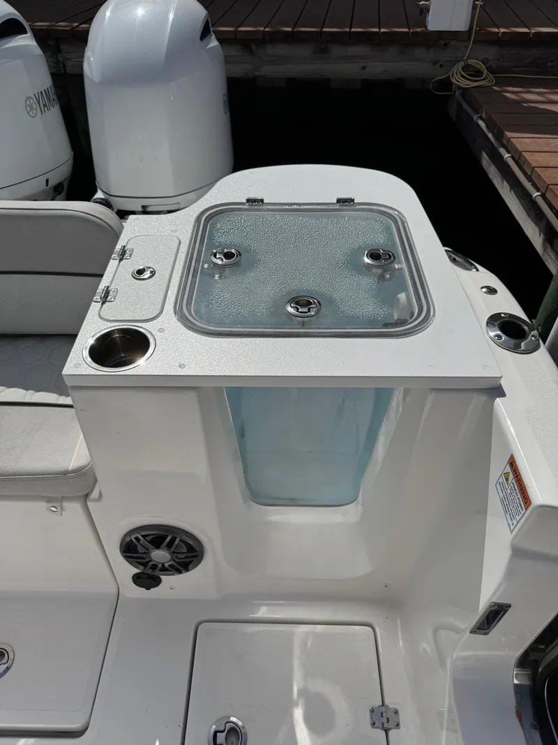Slide: The Image of 2023 Sea Fox 268 Commander boat with livewell and Yamaha engines at dock. - 17