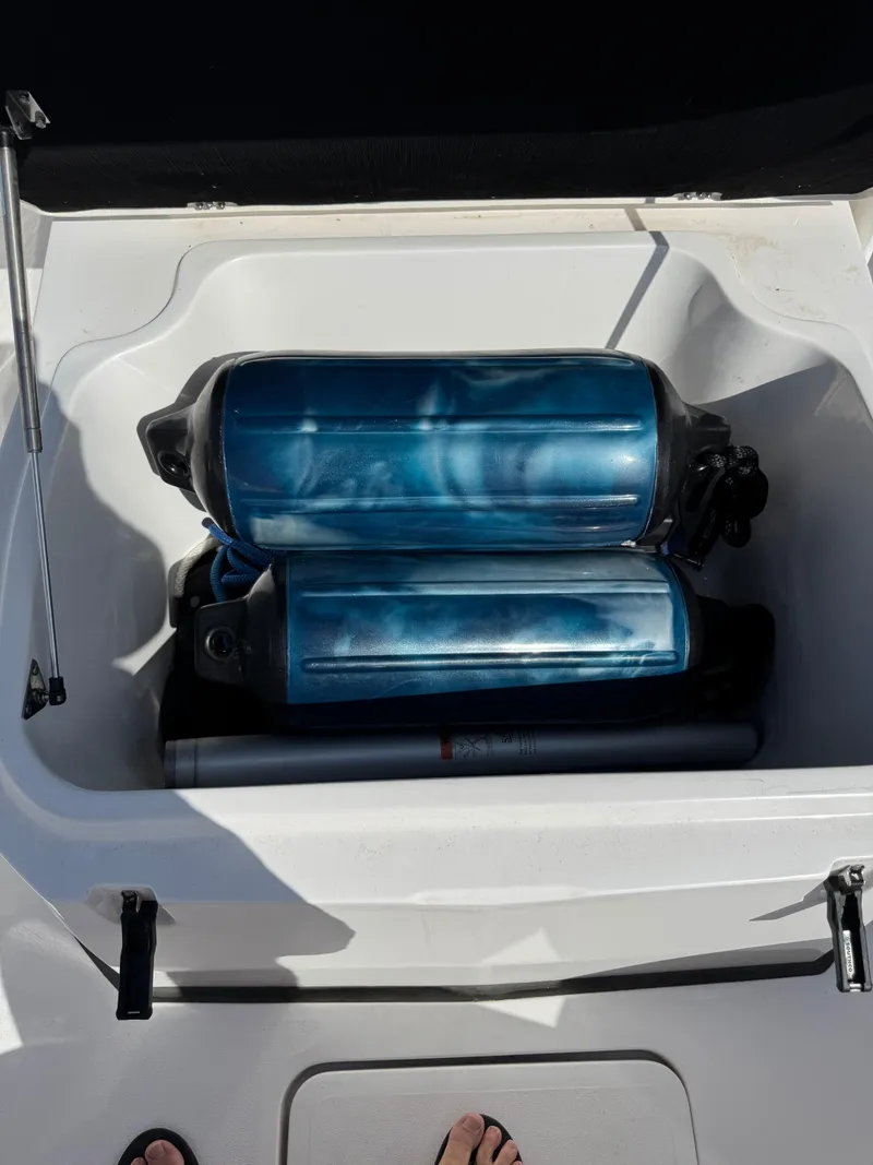 Slide: The Image of Storage compartment on a 2023 Sea Fox 268 Commander boat with blue fenders. - 22