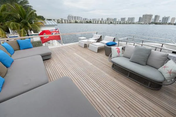 Slide: The Image of Spacious deck of 2017 Sanlorenzo SL106 yacht with modern seating and waterfront view. - 3