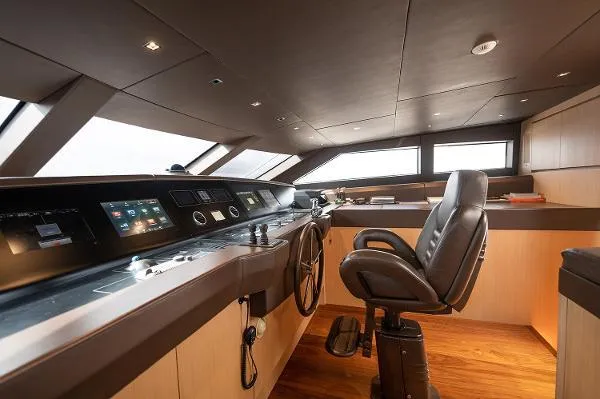 Slide: The Image of Luxurious helm of 2017 Sanlorenzo SL106 yacht with modern controls and leather captain's chair. - 31