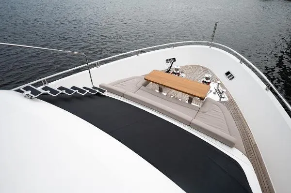 Slide: The Image of Sanlorenzo SL106 2017 yacht bow with seating and table on calm water. - 5