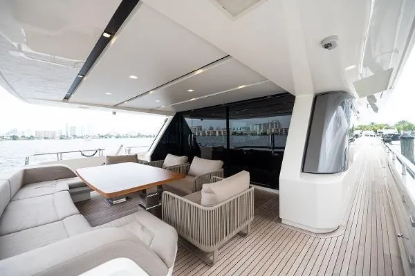Slide: The Image of Luxurious 2017 Sanlorenzo SL106 yacht deck with elegant seating and dining area. - 8