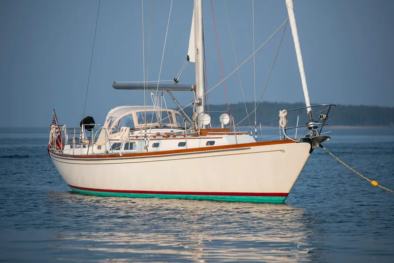 Slide: The Image of 1988 Hinckley Sou'wester 42 sailboat anchored on calm water. - 0