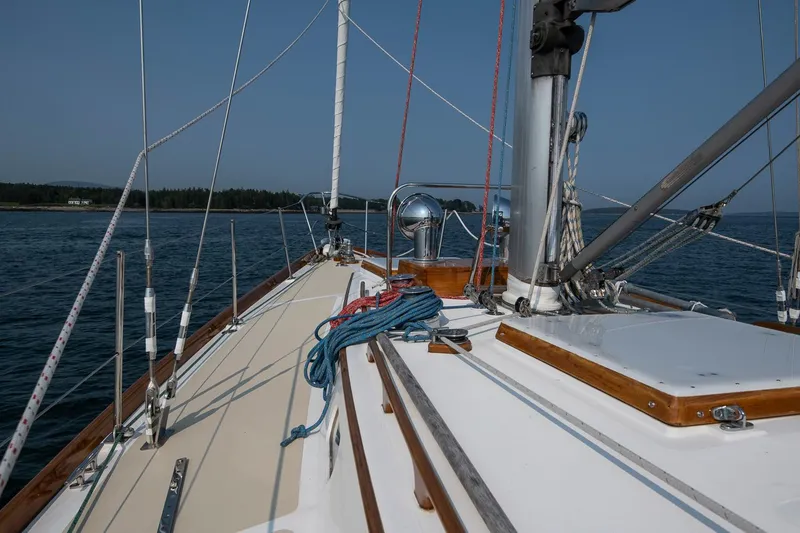 Slide: The Image of Sailing on a 1988 Hinckley Sou'wester 42 yacht, calm waters, clear sky. - 20