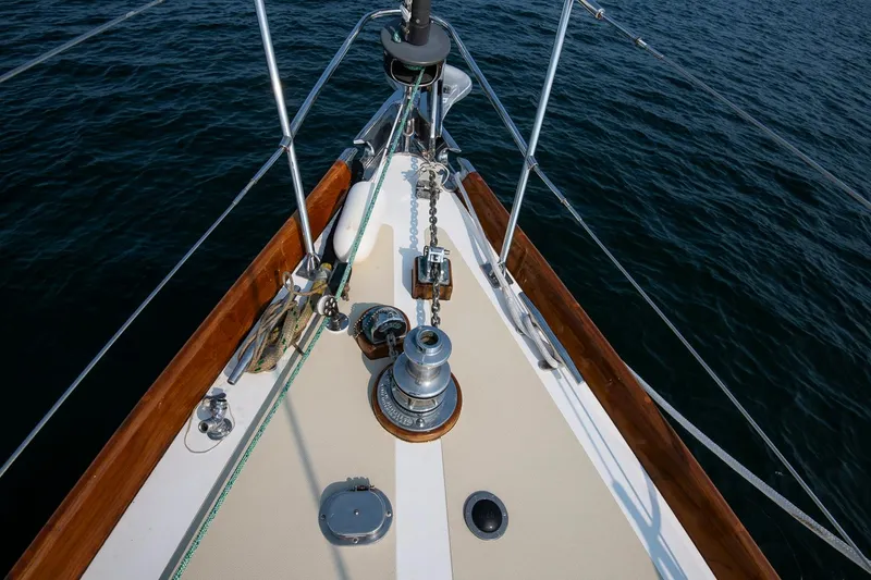 Slide: The Image of Bow of 1988 Hinckley Sou'wester 42 sailboat with winch and ropes on deck. - 22
