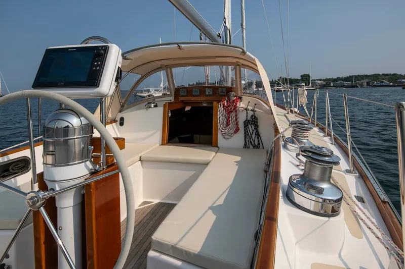 Slide: The Image of 1988 Hinckley Sou'wester 42 sailboat cockpit with steering wheel and navigation equipment. - 29