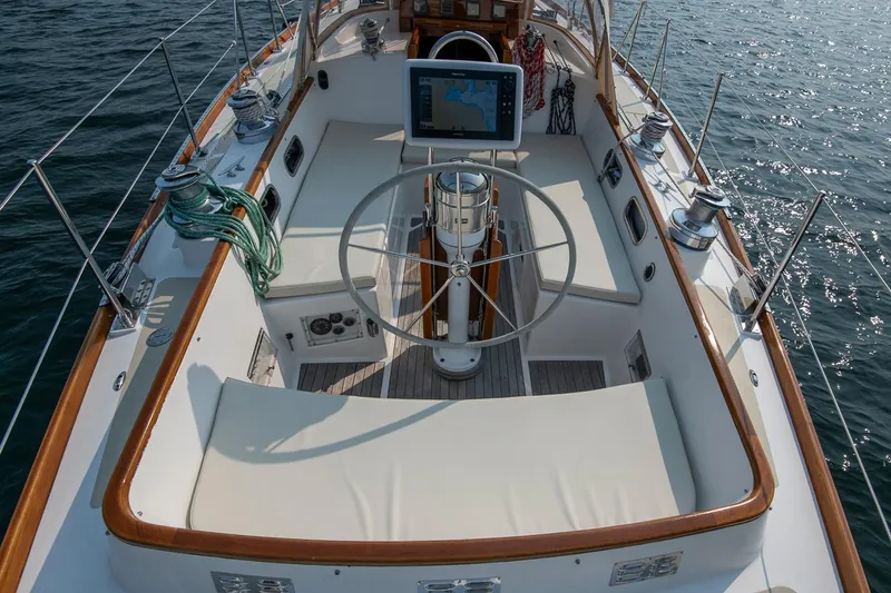 Slide: The Image of Cockpit of 1988 Hinckley Sou'wester 42 sailboat with steering wheel and navigation system. - 30