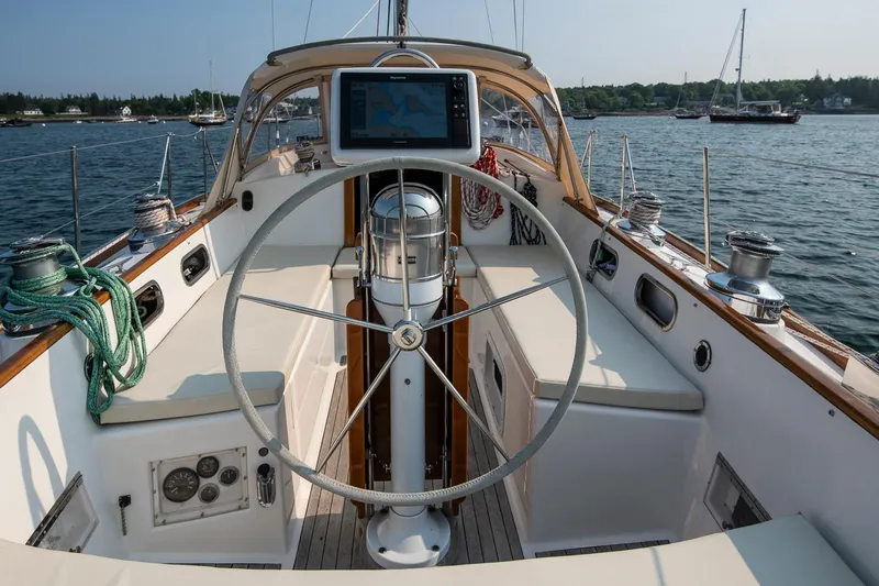Slide: The Image of Cockpit of 1988 Hinckley Sou'wester 42 sailboat with steering wheel and navigation equipment. - 31