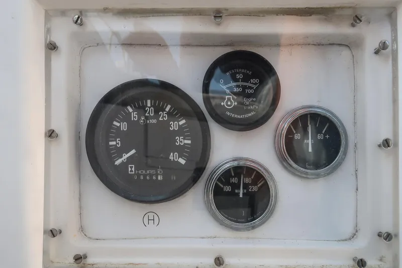 Slide: The Image of Instrument panel of a 1988 Hinckley Sou'wester 42 sailboat, displaying various gauges. - 34