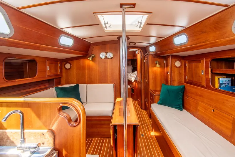 Slide: The Image of Interior of 1988 Hinckley Sou'wester 42 sailboat with wooden finish and cozy seating. - 36