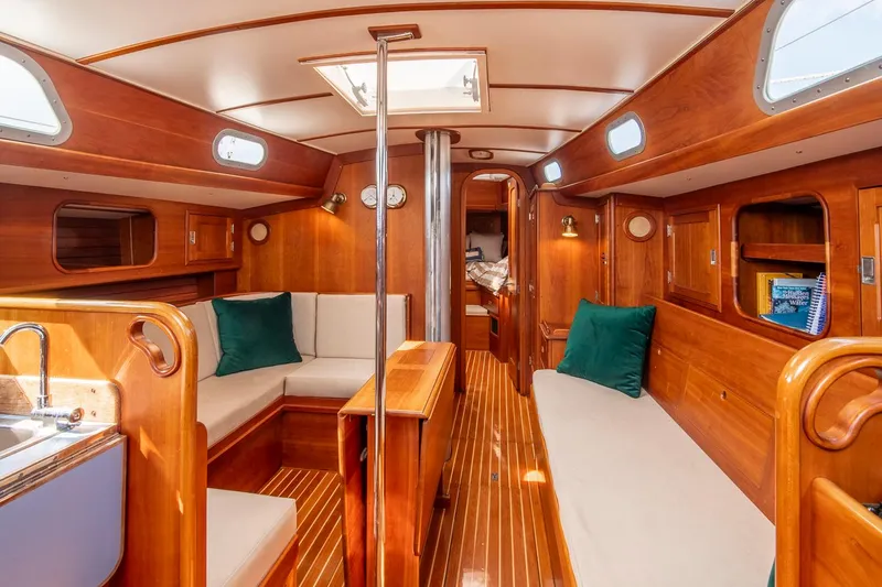 Slide: The Image of Interior of 1988 Hinckley Sou'wester 42 sailboat with wooden finish and cozy seating. - 37