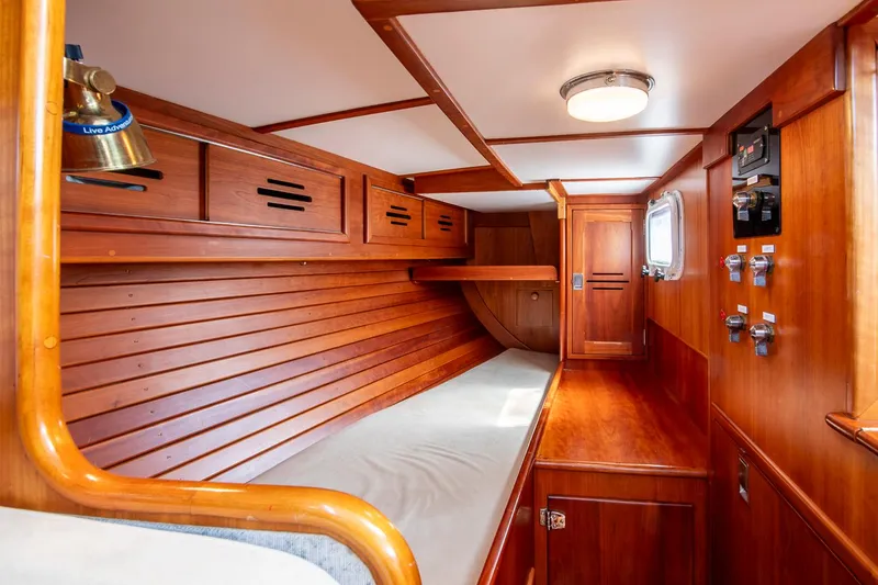 Slide: The Image of Interior of 1988 Hinckley Sou'wester 42 sailboat with wooden paneling and cozy berth. - 41