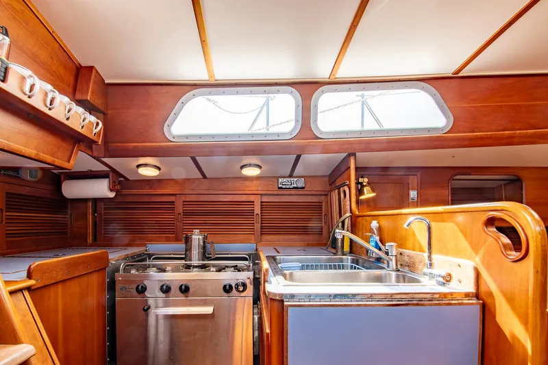 Slide: The Image of Interior of 1988 Hinckley Sou'wester 42 yacht kitchen with stove and sink. - 44