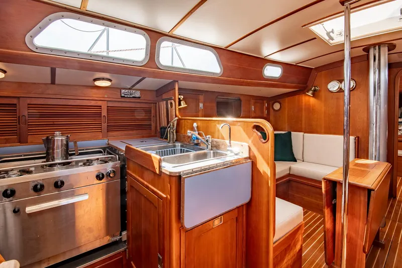 Slide: The Image of Interior of 1988 Hinckley Sou'wester 42 sailboat with kitchen and seating area. - 45