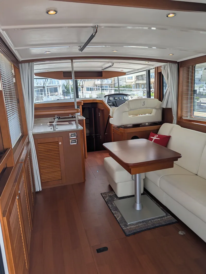 Slide: The Image of Interior of 2019 Beneteau Swift Trawler 44, featuring elegant wood finishes and modern amenities. - 15
