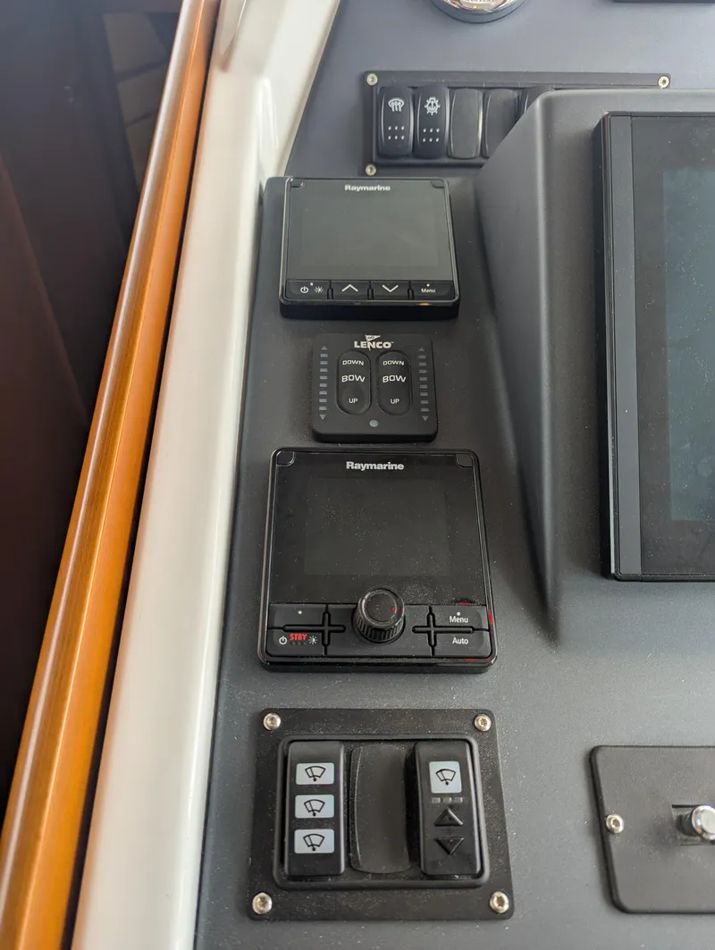 Slide: The Image of Control panel of 2019 Beneteau Swift Trawler 44 with Raymarine and Lenco systems. - 31