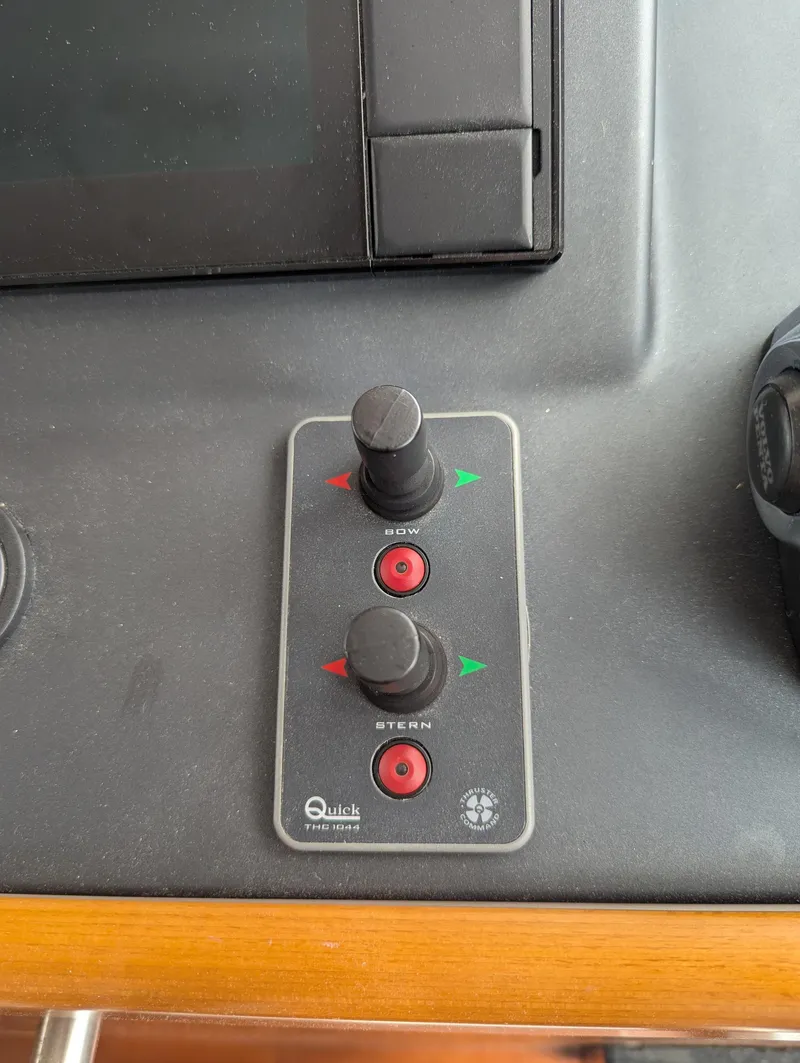 Slide: The Image of Control panel of a 2019 Beneteau Swift Trawler 44 with joystick controls. - 32