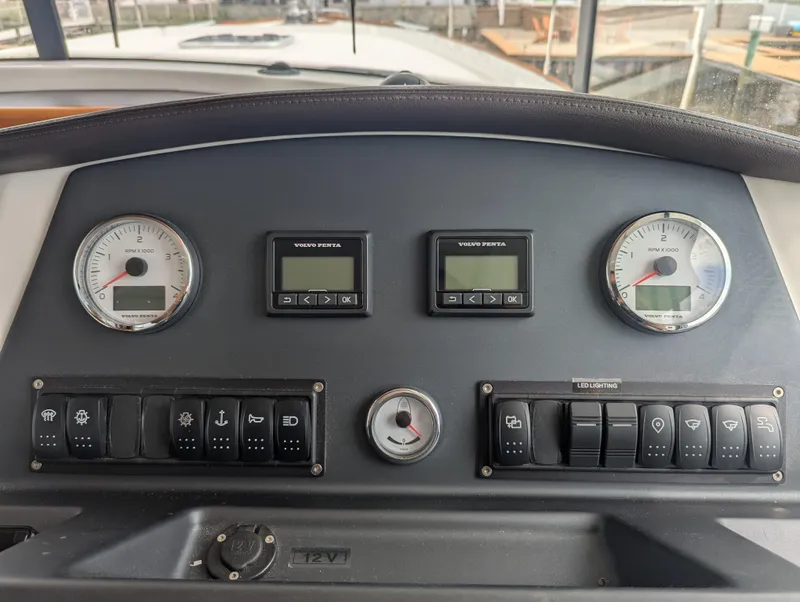 Slide: The Image of Control panel of a 2019 Beneteau Swift Trawler 44 with Volvo Penta gauges and switches. - 34