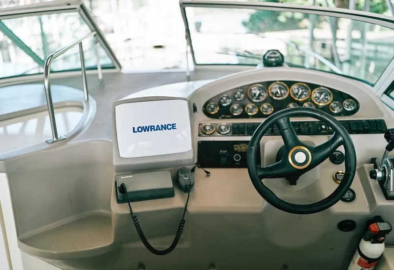 Slide: The Image of Helm of 2001 Cruisers Yachts 3075 Express with Lowrance navigation system and gauges. - 7