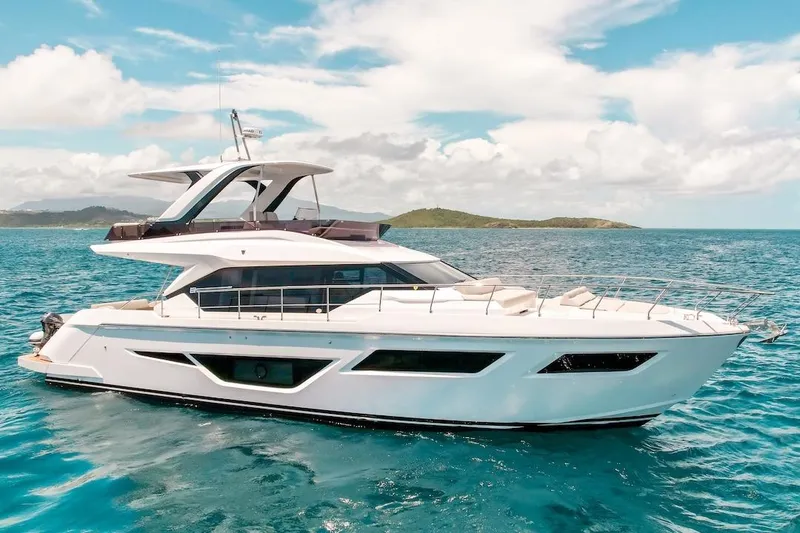 Slide: The Image of 2024 Ferretti Yachts 580 cruising on clear blue ocean waters. - 2