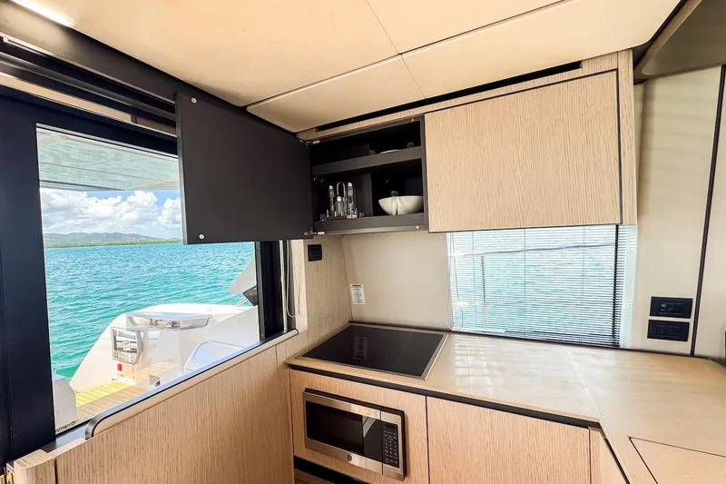 Slide: The Image of Modern kitchen interior on 2024 Ferretti Yachts 580 with ocean view. - 22